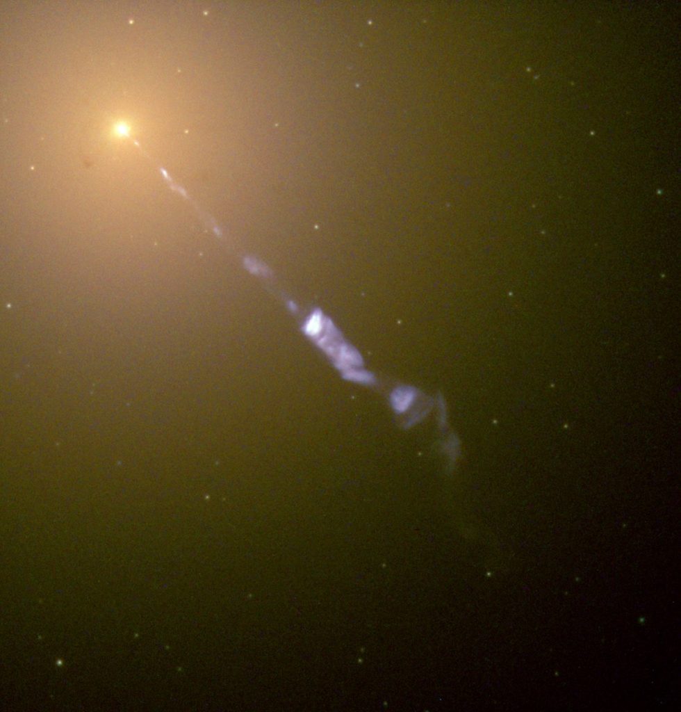 Jet's of particles are blasted from the supermassive black hole at the center of Galaxy M87. Image Credit: NASA