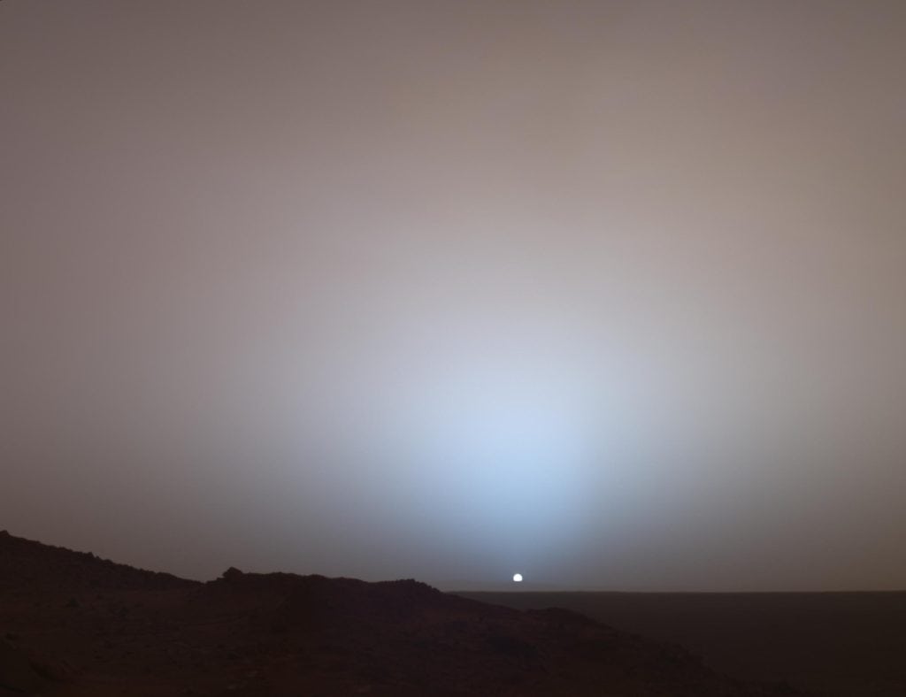A small sun sets on a planet devoid of complex life.
Image Credit: NASA/JPL/Texas A&M/Cornell